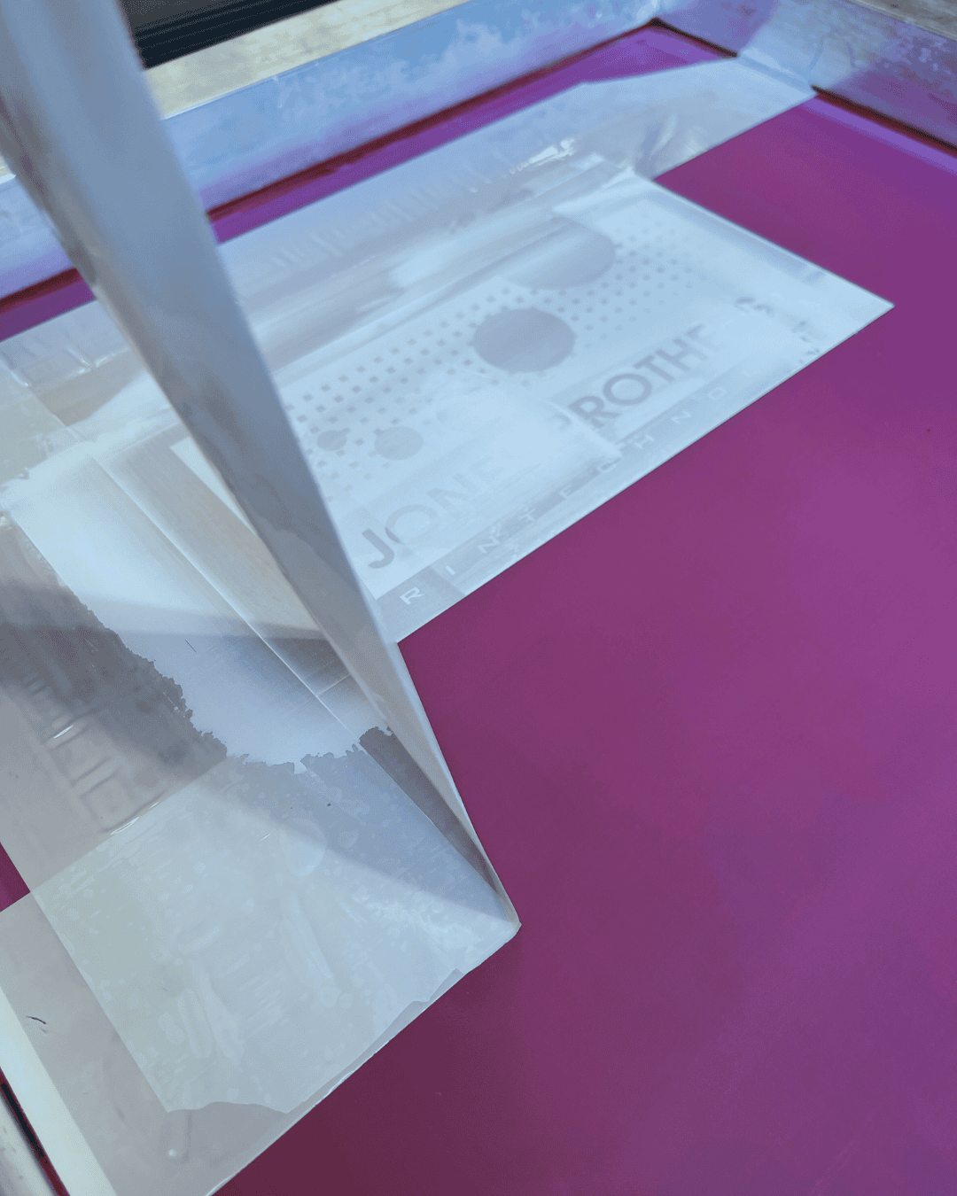 PMI screen printing tape being removed from a screen