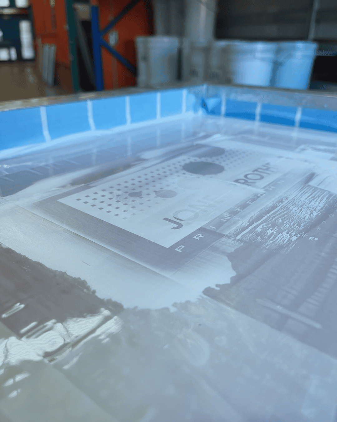 PMI tape sealing the edge of a screen printing stencil