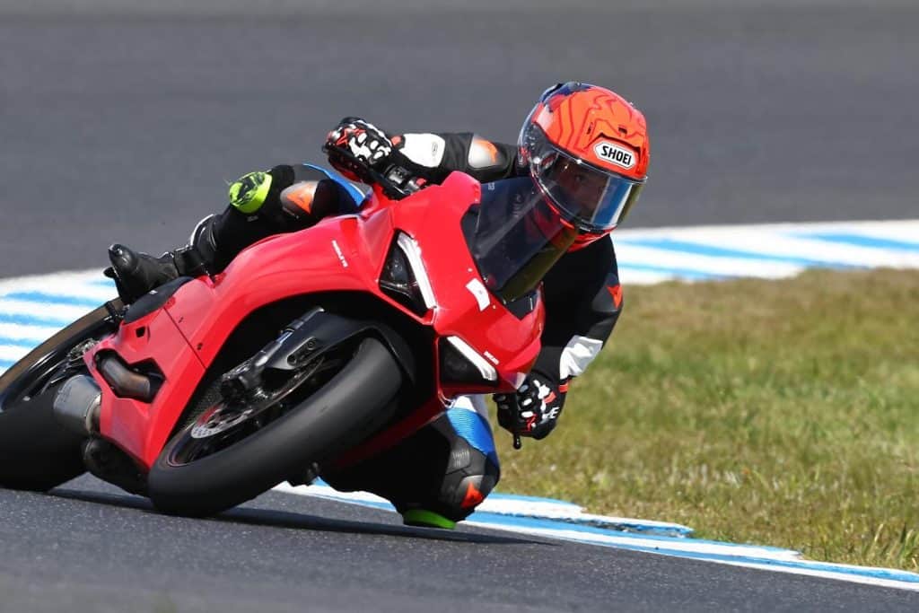 daniel rim on a ducati superbike on a racing track in melbourne - behind the mesh with jones brothers